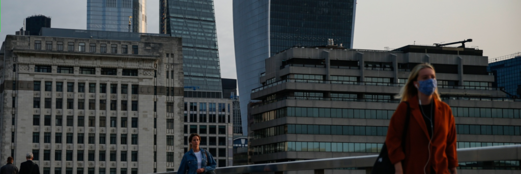 Two women walking through the city