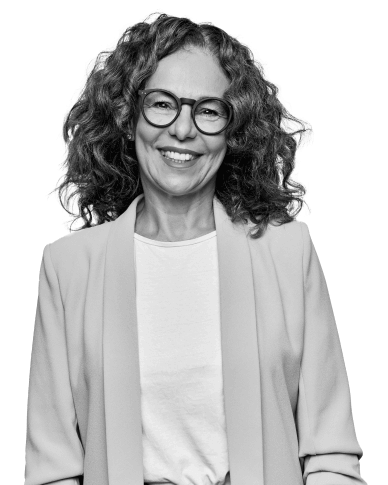 Smiling woman in a jacket and glasses in sepia